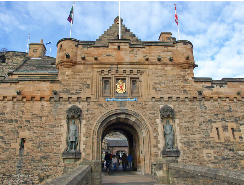 Captivating view of the entrance to Edinburgh Castle, a majestic fortress perched high above the city. The castle's historic stone walls and towering architecture exude a sense of grandeur and mystery.