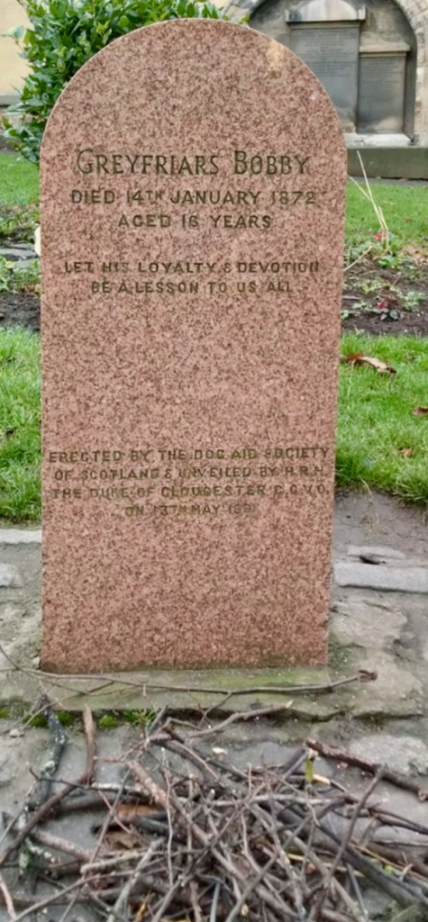 The tombstone bears an inscription honouring Bobby's loyalty to his owner, capturing the hearts of visitors.