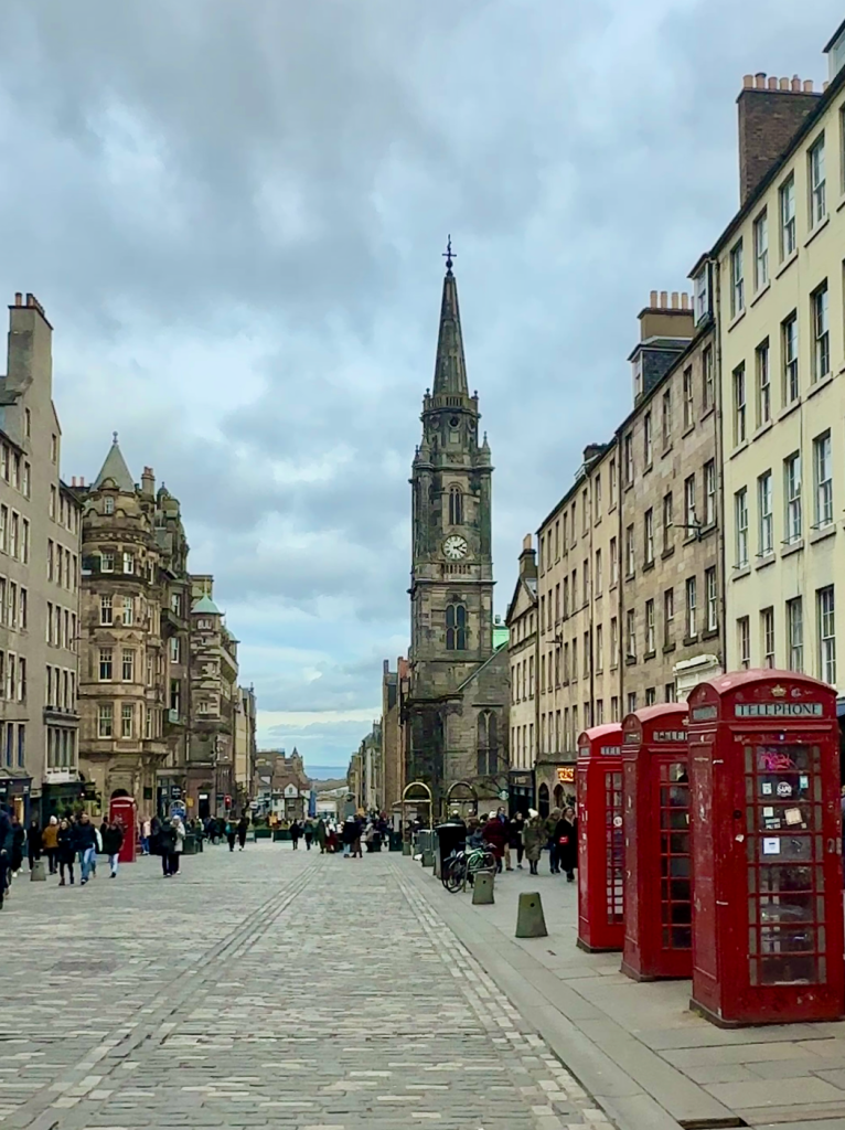 The bustling Royal Mile in Edinburgh, a vibrant street filled with shops, restaurants, and historic landmarks.